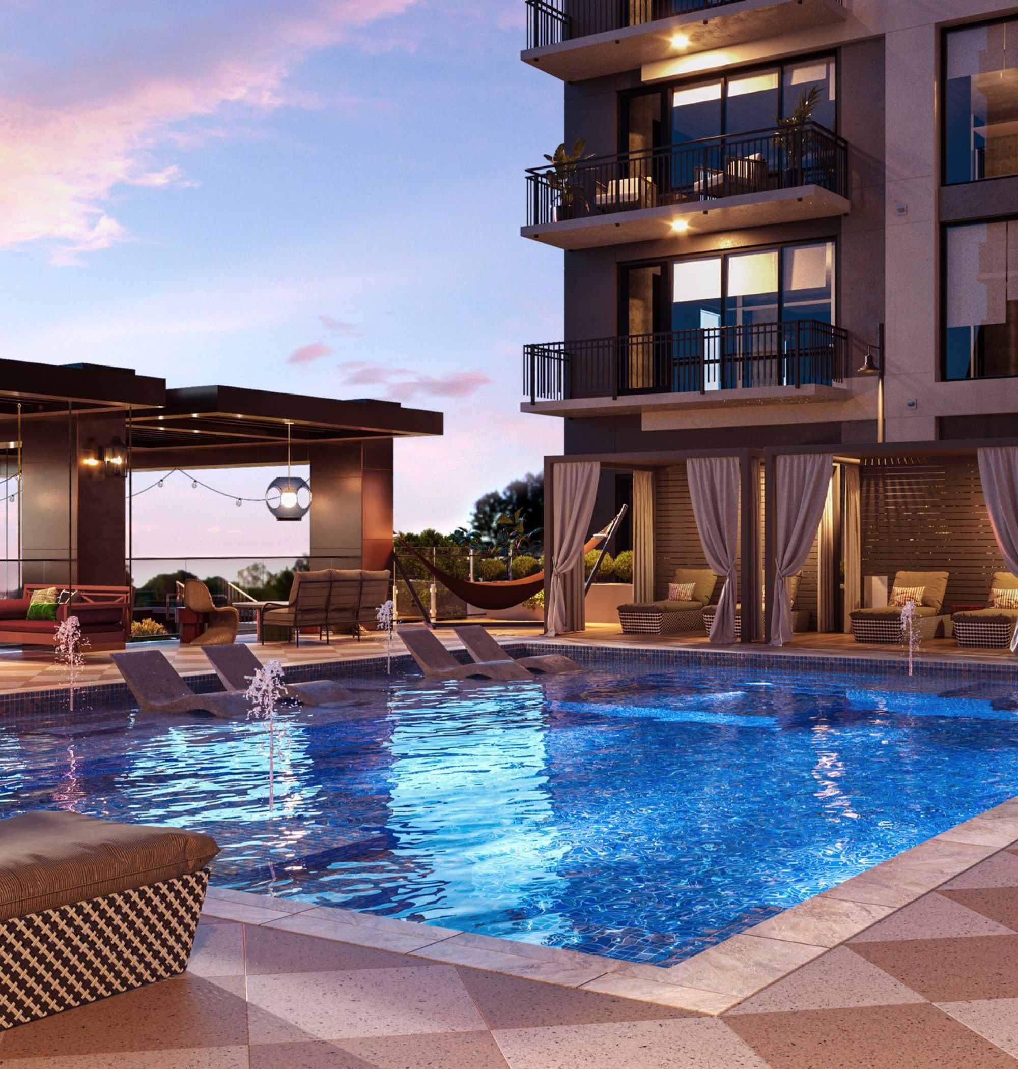 LOCAL Nashville Apartments outdoor pool with cabanas, fountains, and in-pool lounge chairs